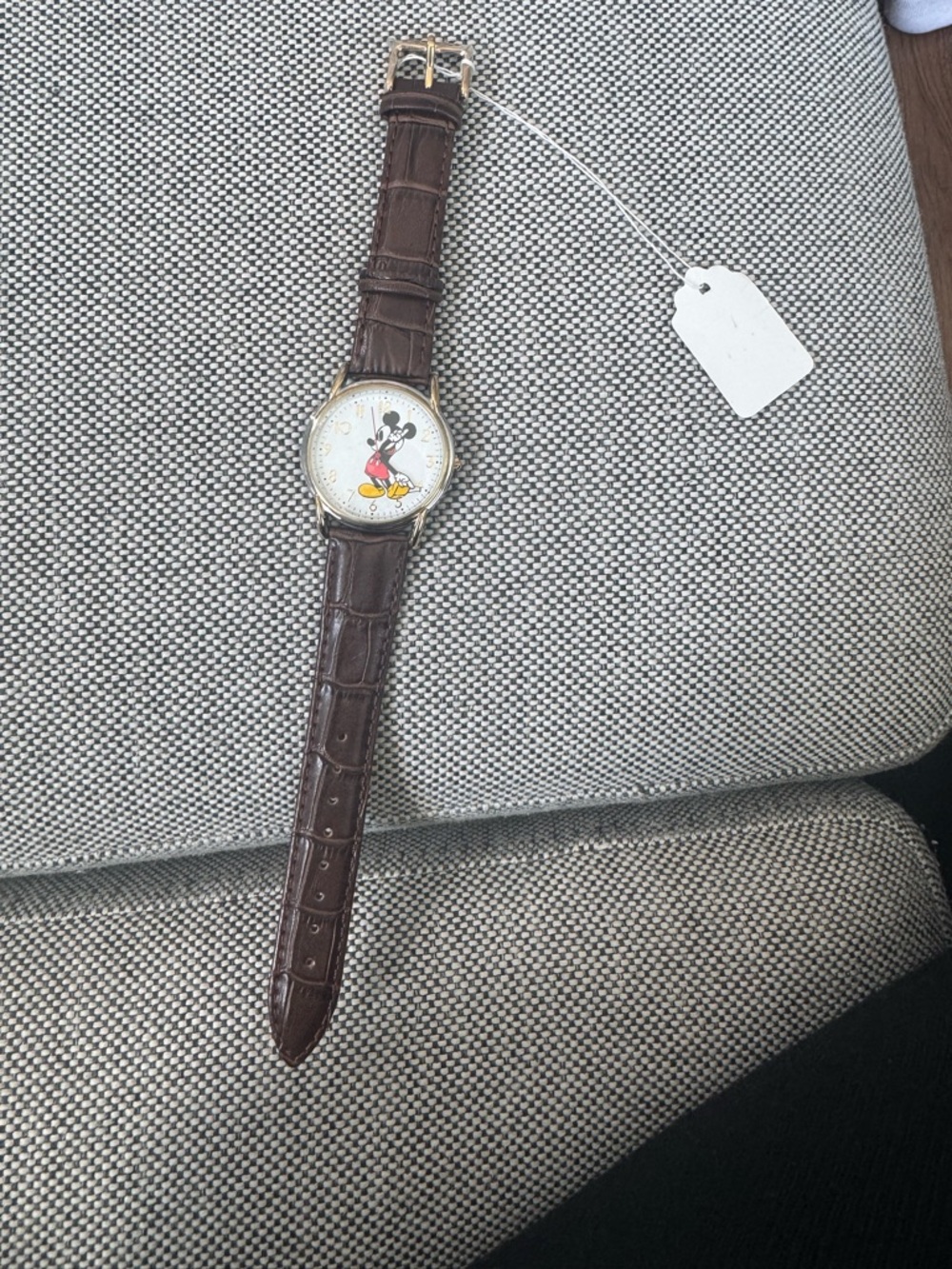 Disney's Mickie Mouse Brown Leather Watch with Character on the Dial.
